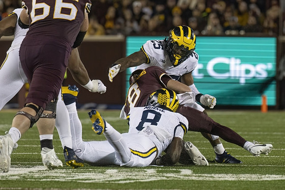 Derrick Moore (8) and Junior Colson (25)