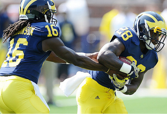 Denard Robinson (16) and Fitzgerald Toussaint (28)