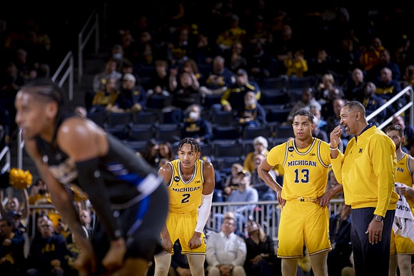 Kobe Bufkin (2), Jett Howard (13), and Juwan Howard