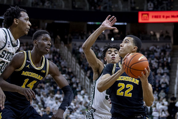 Moussa Diabate (14) and Caleb Houstan (22)