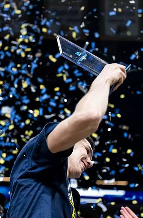 Vladislav Goldin (50) and Big Ten Tournament Championship Most Outstanding Player Trophy