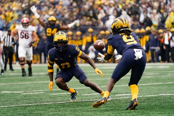 Mike Sainristil (0) and Rod Moore (9)