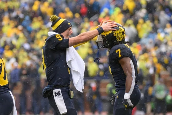 J.J. McCarthy (9) and Donovan Edwards (7)