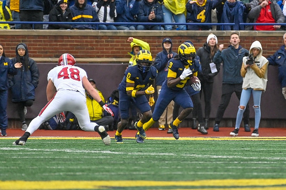 Mike Sainristil (0) and Rod Moore (9)