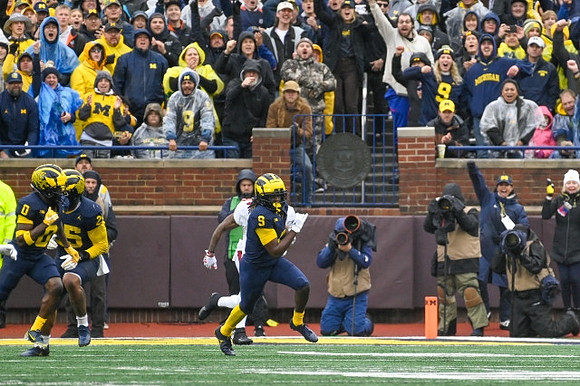 Mike Sainristil (0), Junior Colson (25), and Rod Moore (9)