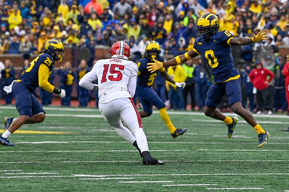 Junior Colson (25), Josaiah Stewart (5), and Mike Sainristil (0)
