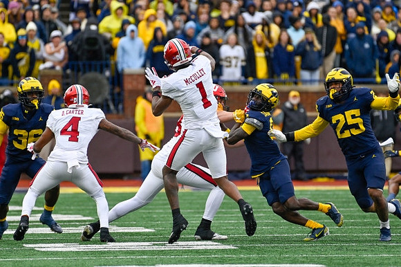 Keshaun Harris (36), Mike Sainristil (0), and Junior Colson (25)