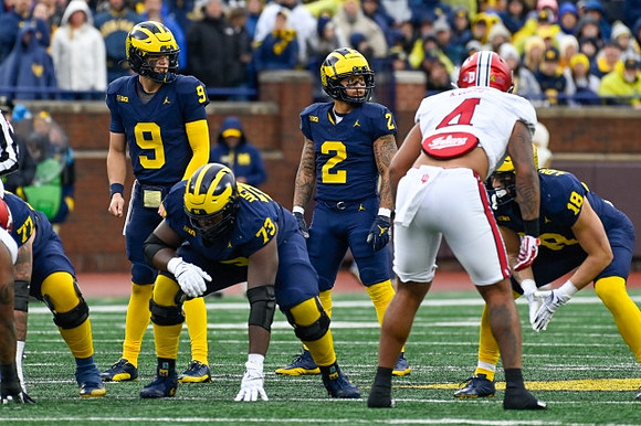 Trevor Keegan (77), J.J. McCarthy (9), LaDarius Henderson (73), Blake Corum (2), and Colston Loveland (18)