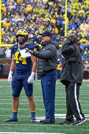 Max Bredeson (44) and Jim Harbaugh