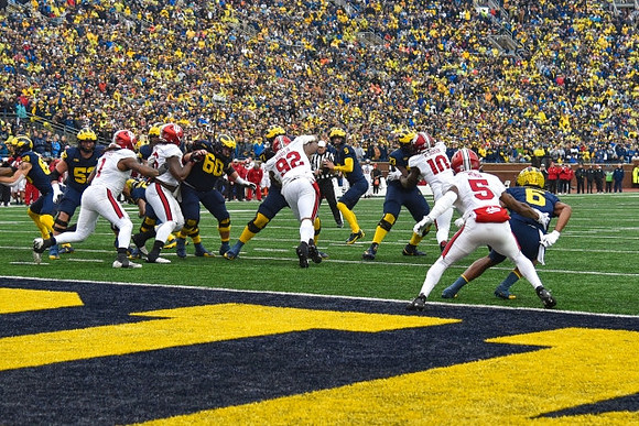 AJ Barner (89), Karsen Barnhart (52), Drake Nugent (60), J.J. McCarthy (9), LaDarius Henderson (73), and Cornelius Johnson (6)