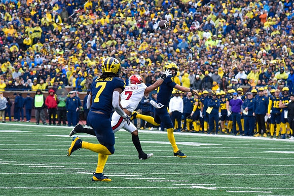 Donovan Edwards (7) and J.J. McCarthy (9)