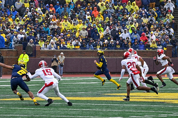 Tyler Morris (8) and J.J. McCarthy (9)