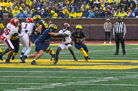 AJ Barner (89), Zak Zinter (65), Roman Wilson (1), and Blake Corum (2)