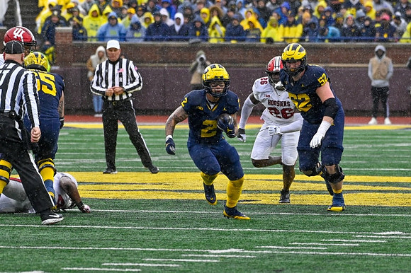 Zak Zinter (65), Blake Corum (2), and Karsen Barnhart (52)