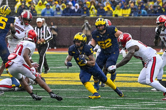 Zak Zinter (65), Blake Corum (2), and Karsen Barnhart (52)