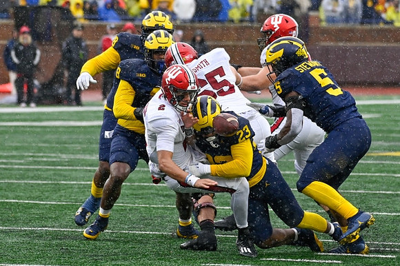 Derrick Moore (8), Michael Barrett (23), and Josaiah Stewart (5)