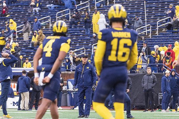 Jayden Denegal (4), J.J. McCarthy (9), and Jim Harbaugh