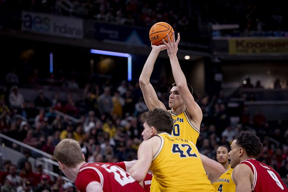 Will Tschetter (42), Vladislav Goldin (50), and Nimari Burnett (4)