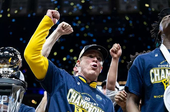 Dusty May, Michigan Team, and Big Ten Tournament Championship Trophy