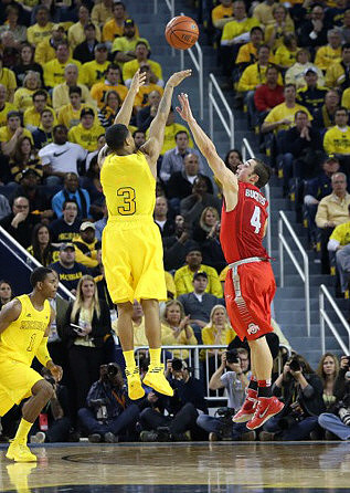 Trey Burke (3) and Glenn Robinson III (1)