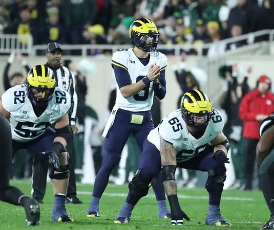 Karsen Barnhart (52), J.J. McCarthy (9), and Zak Zinter (65)