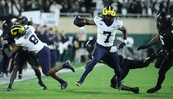 Tyler Morris (8) and Donovan Edwards (7)