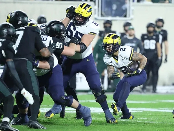 Drake Nugent (60), Zak Zinter (65), and Blake Corum (2)