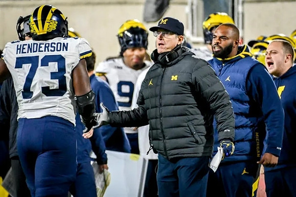 LaDarius Henderson (73) and Jim Harbaugh