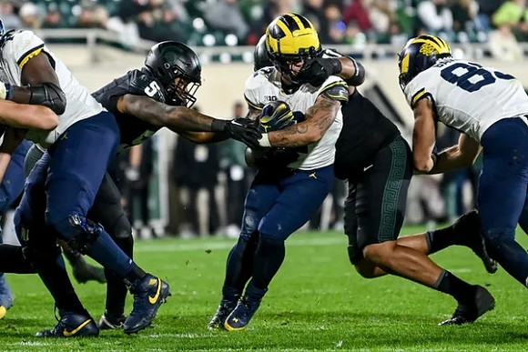 Blake Corum (2) and AJ Barner (89)