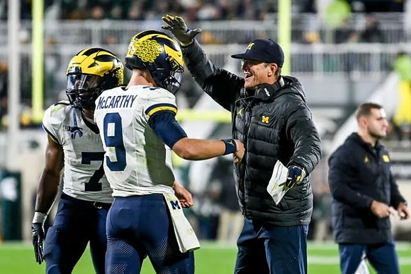 Donovan Edwards (7), J.J. McCarthy (9), and Jim Harbaugh
