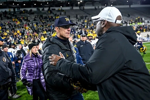 Jim Harbaugh and Michigan State Head Coach Harlon Barnett