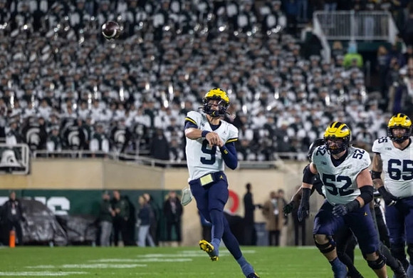 J.J. McCarthy (9), Karsen Barnhart (52), and Zak Zinter (65)