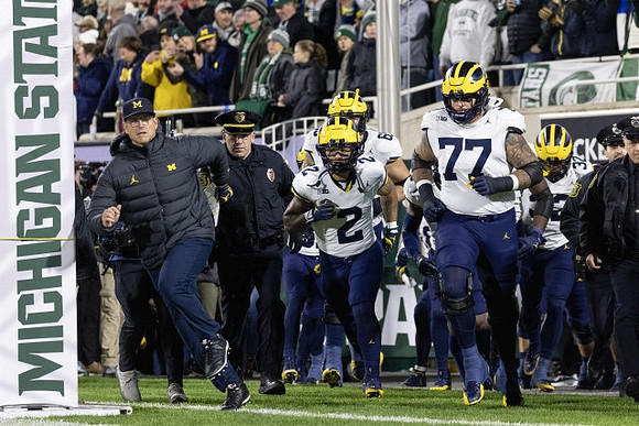 Blake Corum (2), Trevor Keegan (77), and Michigan Team