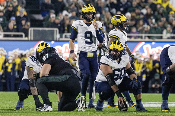 Zak Zinter (65), J.J. McCarthy (9), Drake Nugent (60), and Blake Corum (2)