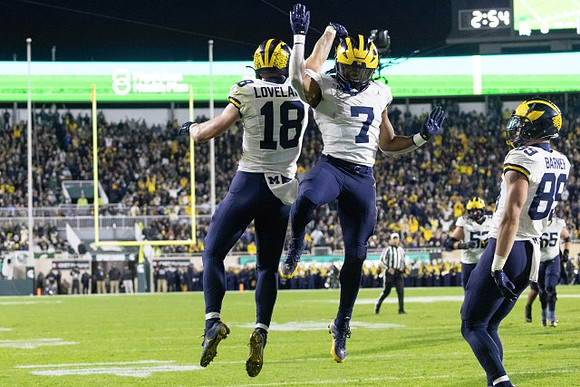 Colston Loveland (18), Donovan Edwards (7), and AJ Barner (89)