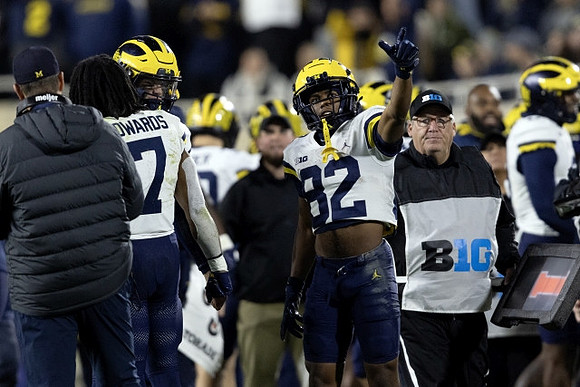 Jim Harbaugh, Donovan Edwards (7), and Semaj Morgan (82)