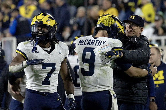 Donovan Edwards (7), J.J. McCarthy (9), and Jim Harbaugh