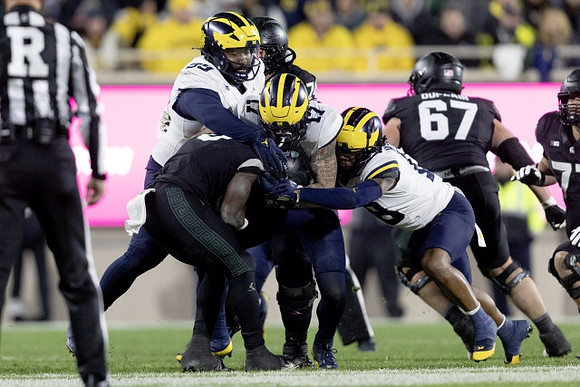 Cam Goode (99), Braiden McGregor (17), and Ja'Den McBurrows (18)