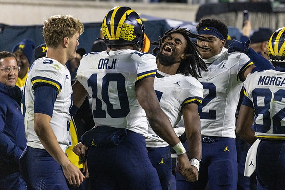 J.J. McCarthy (9), Alex Orji (10), Donovan Edwards (7), Will Johnson (2), and Semaj Morgan (82)