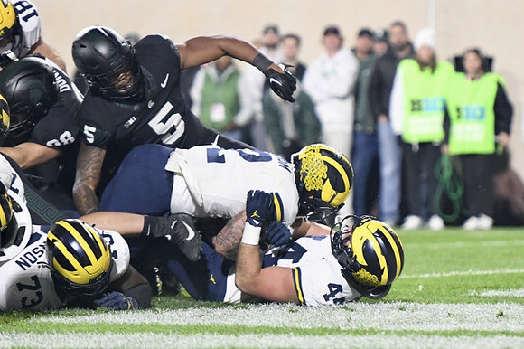 LaDarius Henderson (73), Blake Corum (2), and Max Bredeson (44)