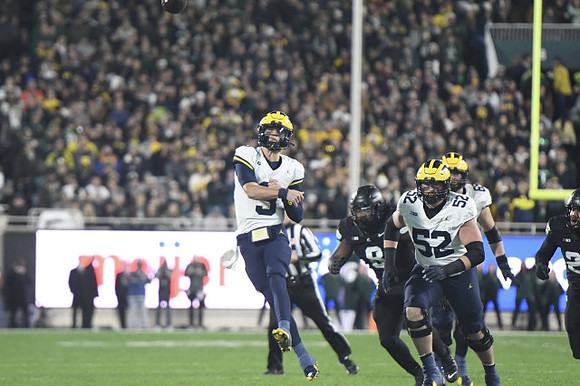 J.J. McCarthy (9), Karsen Barnhart (52), and Zak Zinter (65)
