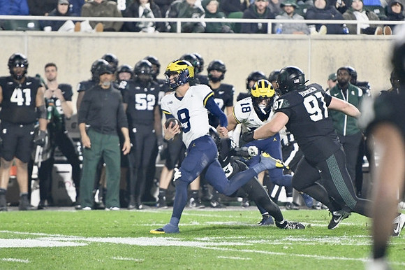 J.J. McCarthy (9) and Colston Loveland (18)