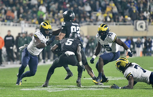 Jaylen Harrell (32), Ernest Hausmann (15), and Makari Paige (7)