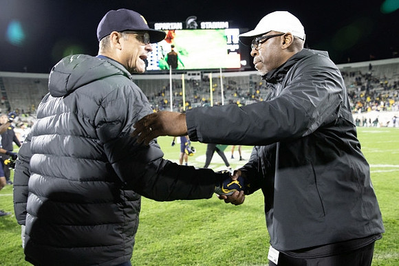 Jim Harbaugh and Michigan State Head Coach Harlon Barnett
