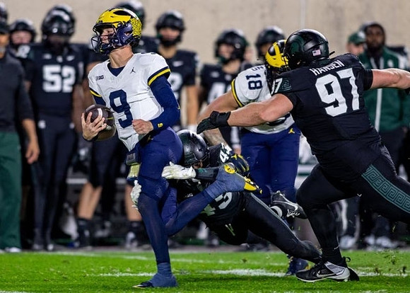 J.J. McCarthy (9) and Colston Loveland (18)