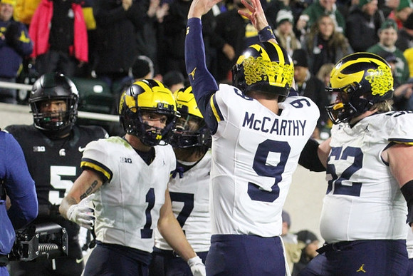 Roman Wilson (1), Donovan Edwards (7), J.J. McCarthy (9), and Karsen Barnhart (52)