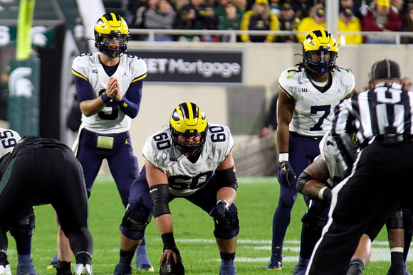 Zak Zinter (65), J.J. McCarthy (9), Drake Nugent (60), and Donovan Edwards (7)