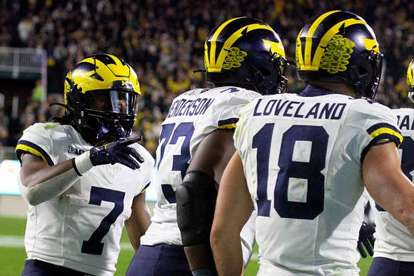 Donovan Edwards (7), LaDarius Henderson (73), and Colston Loveland (18)