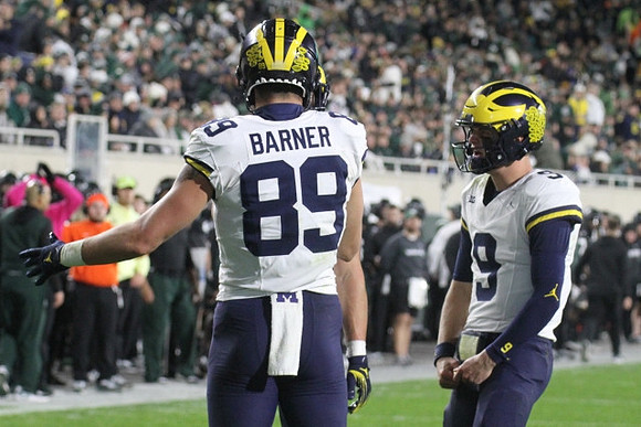 AJ Barner (89) and J.J. McCarthy (9)