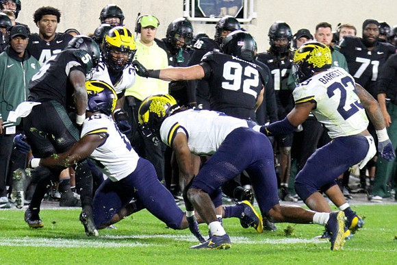 Ernest Hausmann (15), Jaylen Harrell (32), Michael Barrett (23), and Makari Paige (7)